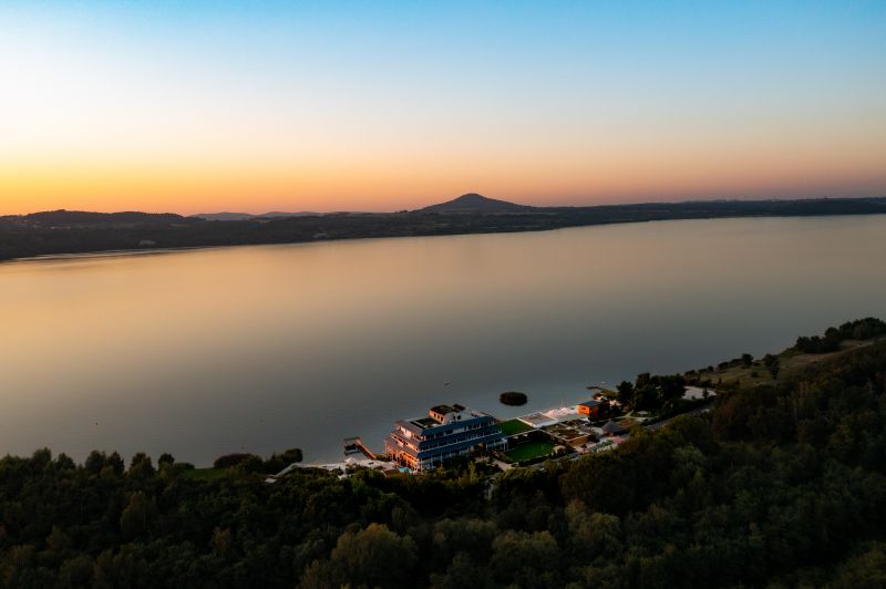 bird view hotel with lake in the background
